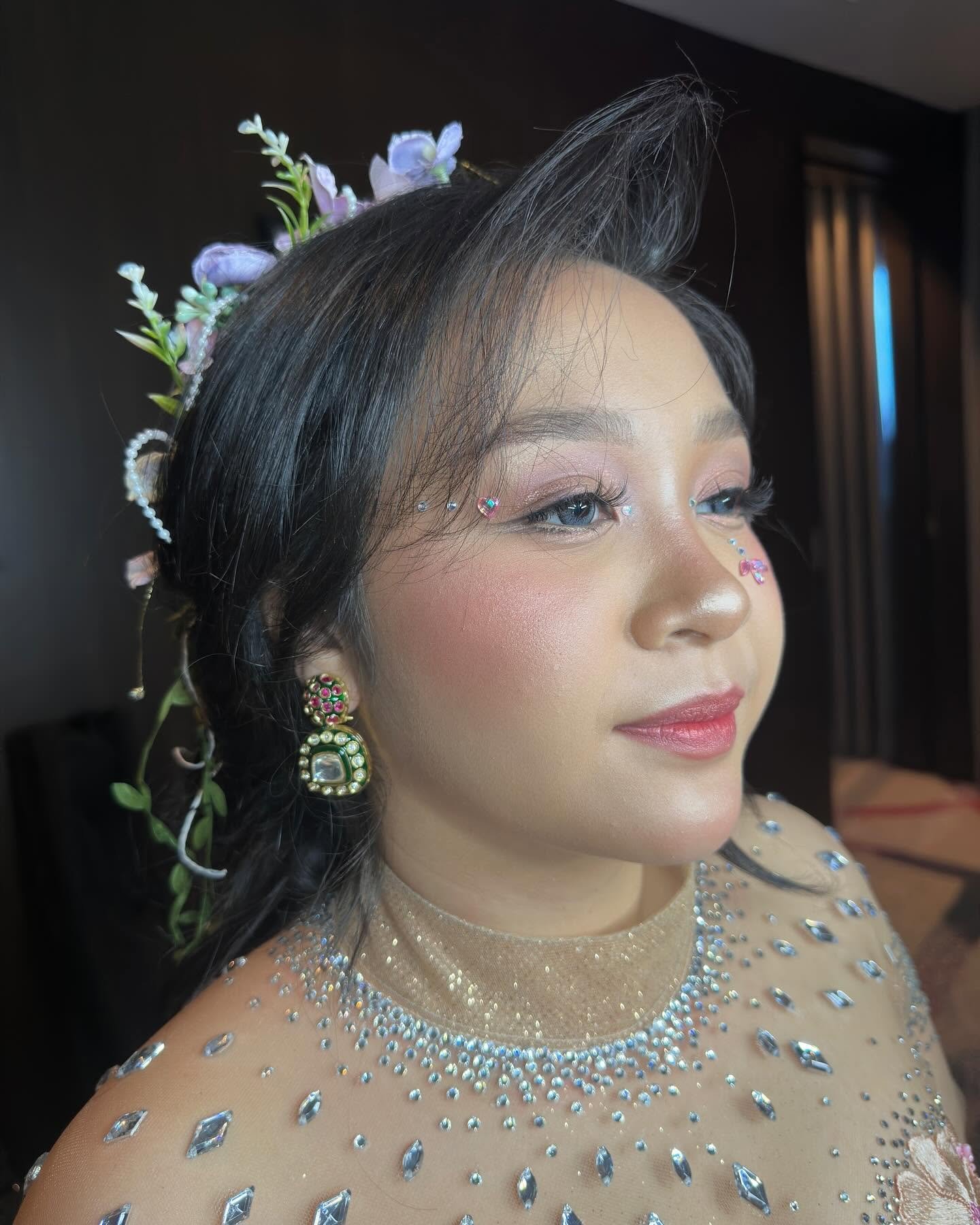 Editorial fairy theme prom makeup look with jeweled face gems