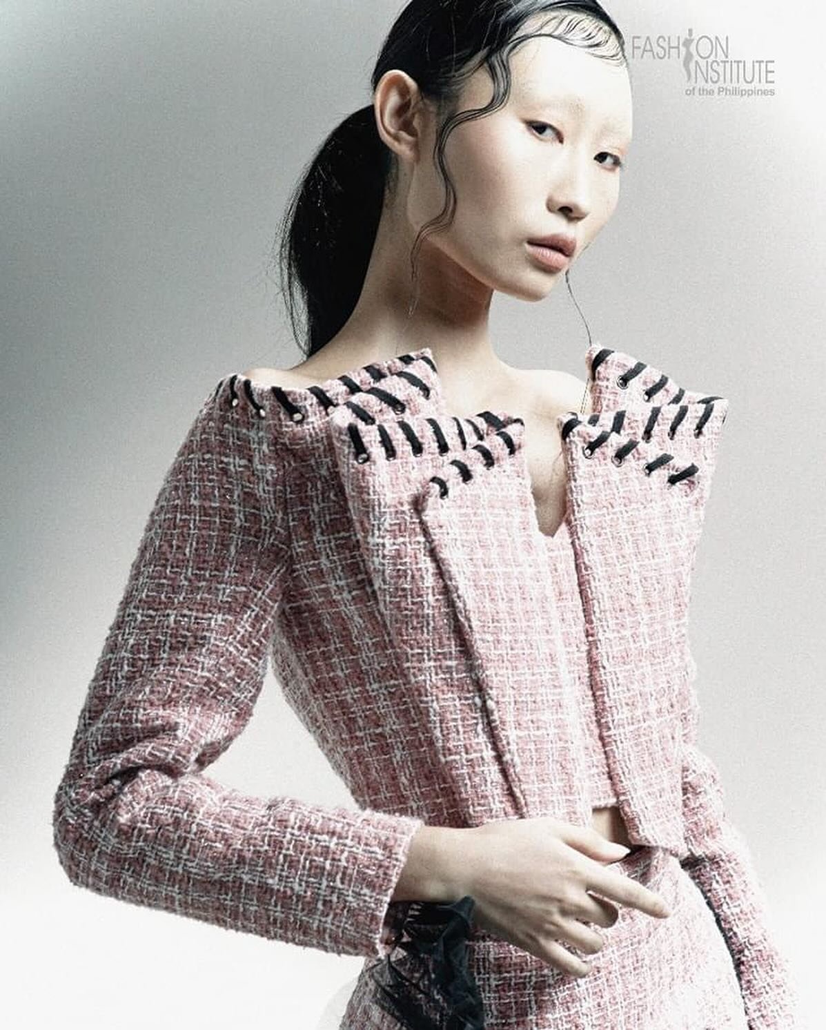 Soft editorial makeup with sleek wet-look hair for a fashion graduation collection