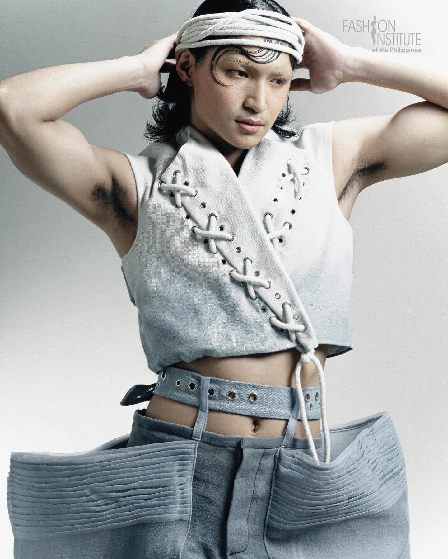 Clean masculine editorial makeup with sculpted hair detailing for a menswear fashion campaign