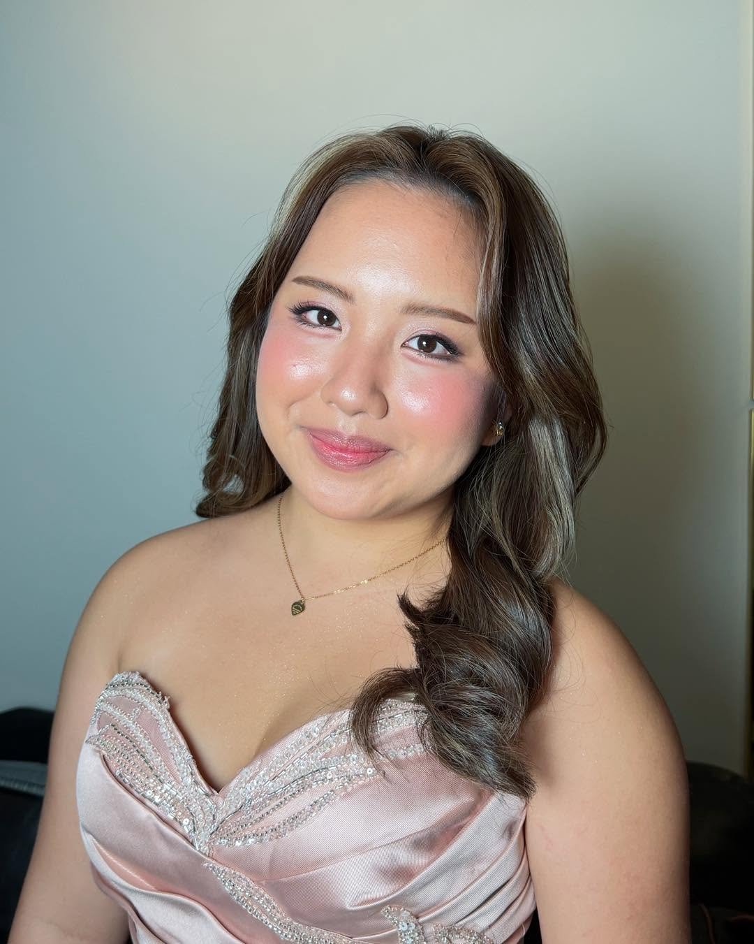 Debutante glam makeup look in a blush gown